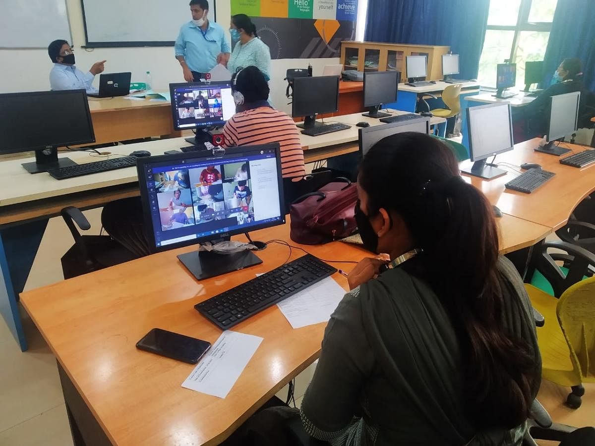 Faculty at a control room at KLETU in Hubballi observe final year engineering students writing online examination.