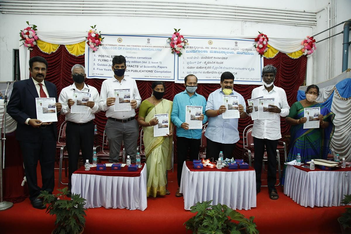Minister for Fisheries, Ports and Inland Water Transport Kota Srinivas Poojary and others release ‘Flying fish’ a tri-monthly edition of College of Fisheries at Hoige Bazar in Mangaluru.