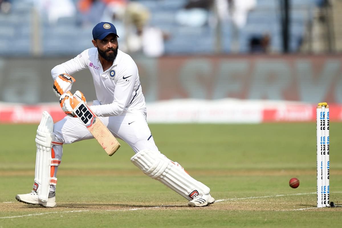 Indian batsman Ravindra Jadeja plays a shot during the second day of the second Test cricket match between India and South Africa, at Maharashtra Cricket Association Stadium in Pune on October 11, 2019.  Credit/AFP Photo