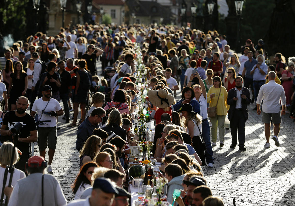 Residents dine at a 500-metre-long table spanning across the length of the medieval Charles Bridge as restrictions ease following the coronavirus disease (COVID-19) outbreak, in Prague, Czech Republic June 30, 2020. Credit/Reuters Photo