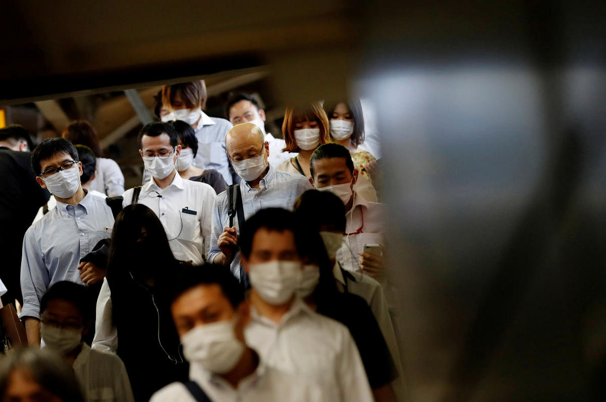 Passengers wearing protective masks make their way amid the coronavirus disease (COVID-19) outbreak at a subway station in Tokyo, Japan June 29, 2020. Credit/Reuters File Photo