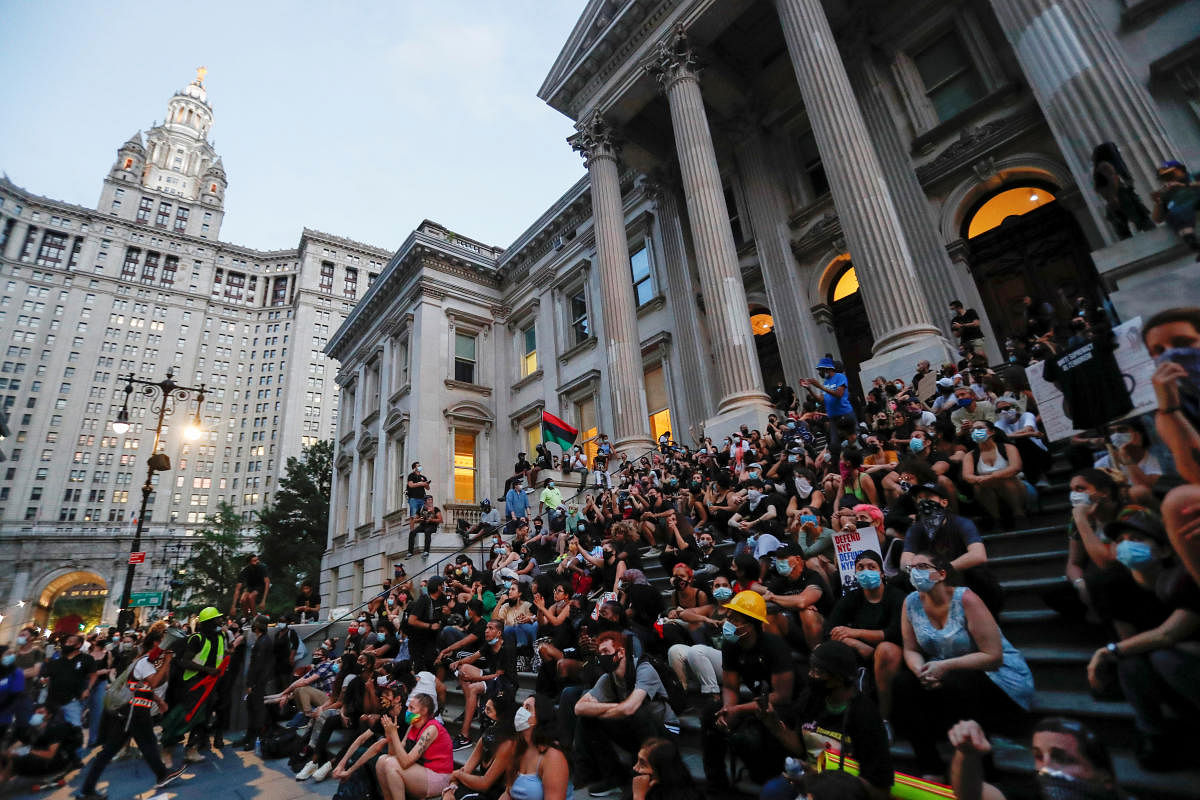 Demonstrators gather near an area being called the "City Hall Autonomous Zone" that has been established to protest the New York Police Department and in support of "Black Lives Matter" near City Hall in lower Manhattan, in New York City, U.S., June 30, 2020. Credit/Reuters Photo