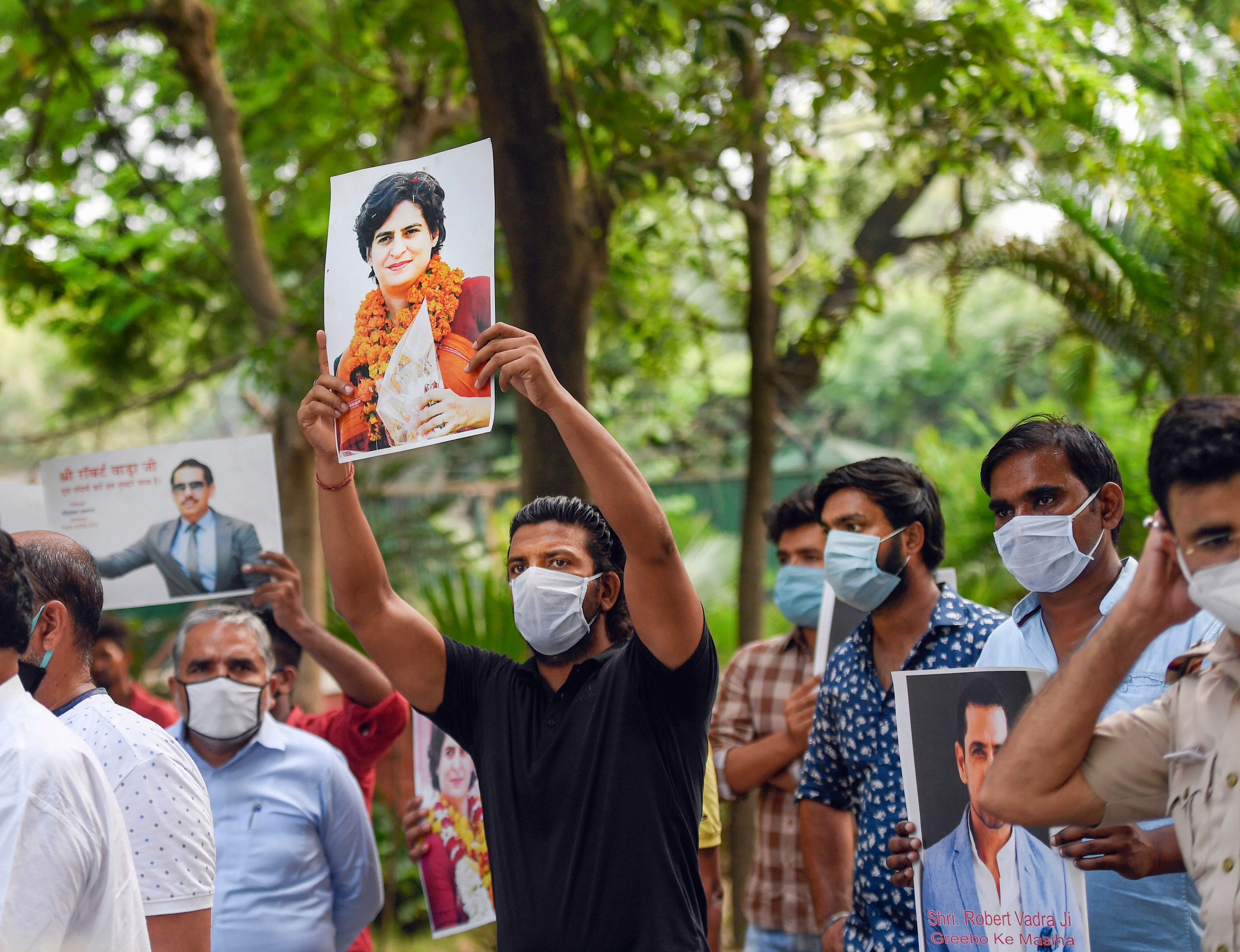 Congress supporters stage a protest against the central government's decision for asking AICC General Secretary Priyanka Gandhi Vadra to vacate her bungalow within a month as she is not entitled to the facility following the withdrawal of her SPG protection. Credits: PTI Photo