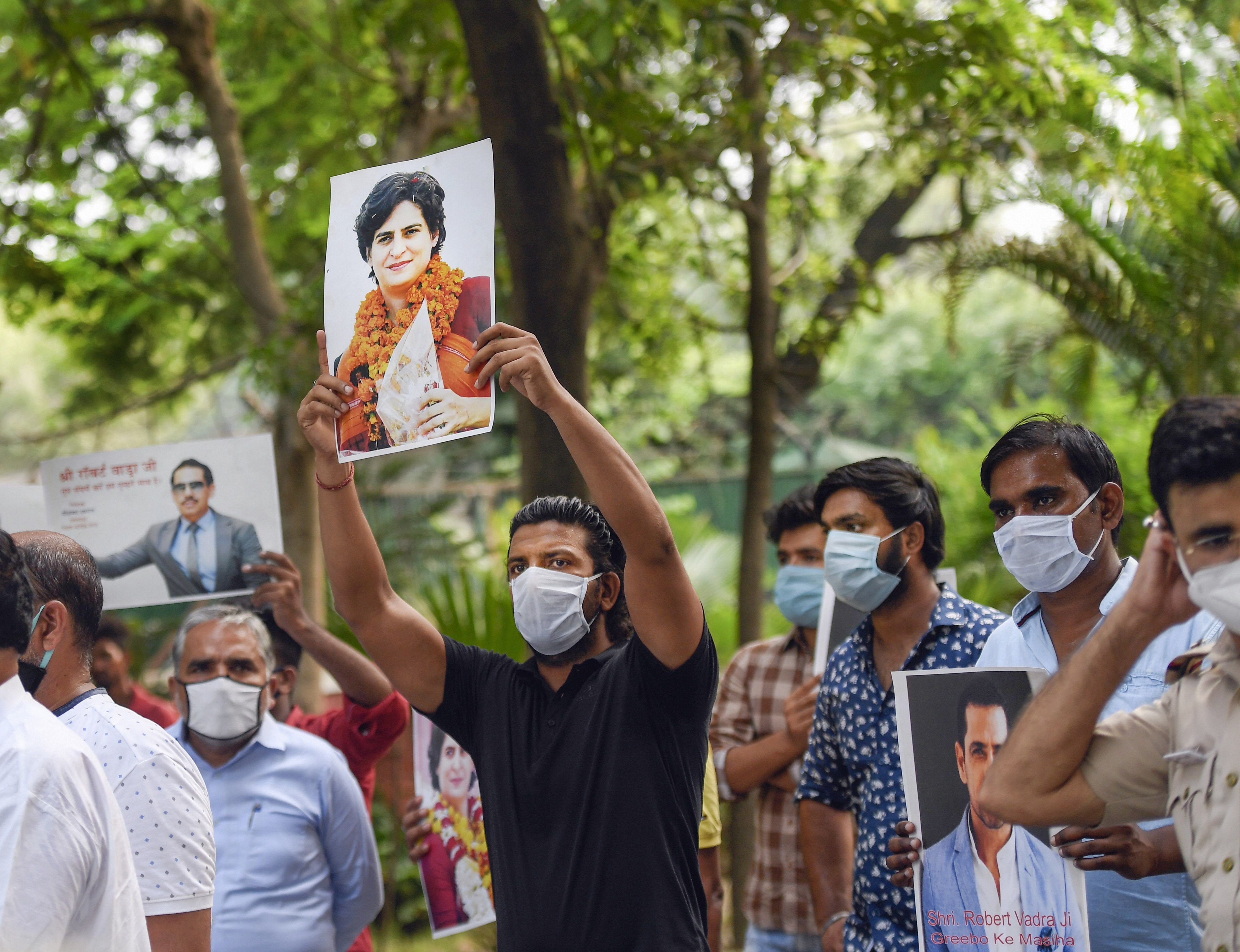 Congress supporters stage a protest against the central government's decision for asking AICC General Secretary Priyanka Gandhi Vadra to vacate her bungalow within a month as she is not entitled to the facility following the withdrawal of her SPG protection. Credits: PTI Photo