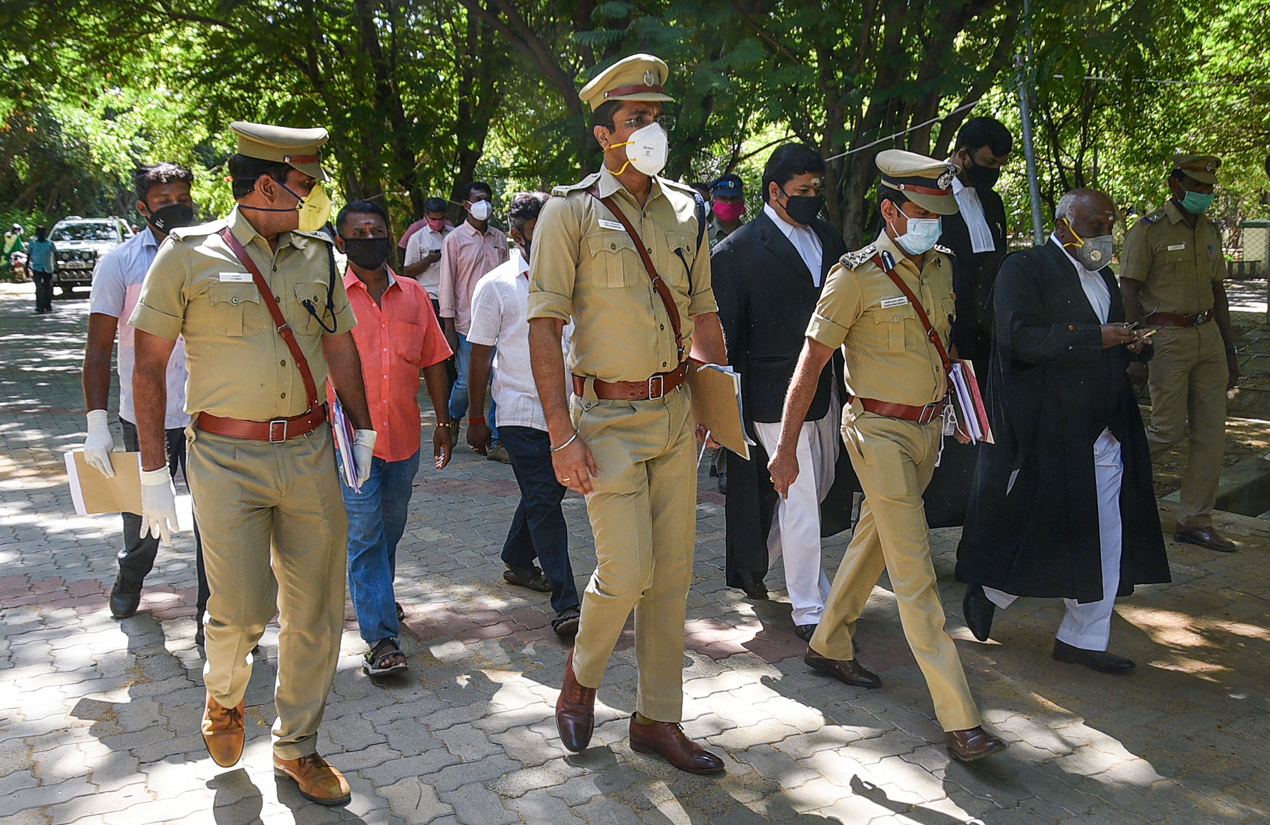 Thoothukudi SP Arun Balagopalan (C) Additional Superintendent of Police D Kumar (L), DSP C Prathapan (2nd from R) and police constable Maharajan ( extreme L) arrive to appear before the Madurai Bench of Madras High Court for Sathankulam custodial deaths, in Madurai, Tuesday, June 30, 2020. (PTI Photo)