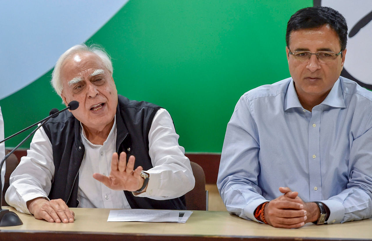 In a memorandum to the EC, Congress leaders Randeep Singh Surjewala, Kapil Sibal, Ahmed Patel termed the decision to allow postal ballots for those over 65 and Covid-19 patients as “unconstitutional and illegal” and demanded its immediate withdrawal. Credit: PTI File Photo