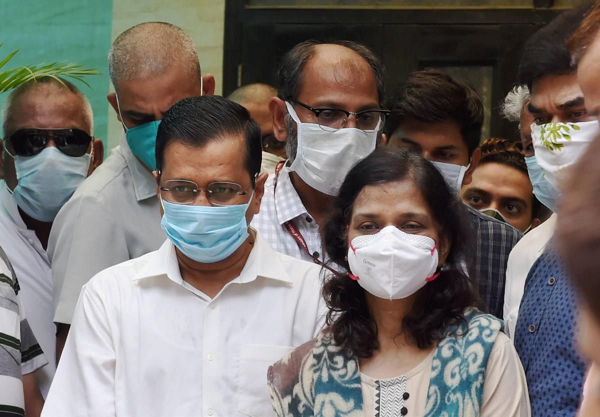 Chief Minister Arvind Kejriwal visits the family of late Dr Aseem Gupta at their residence, in East Delhi. PTI