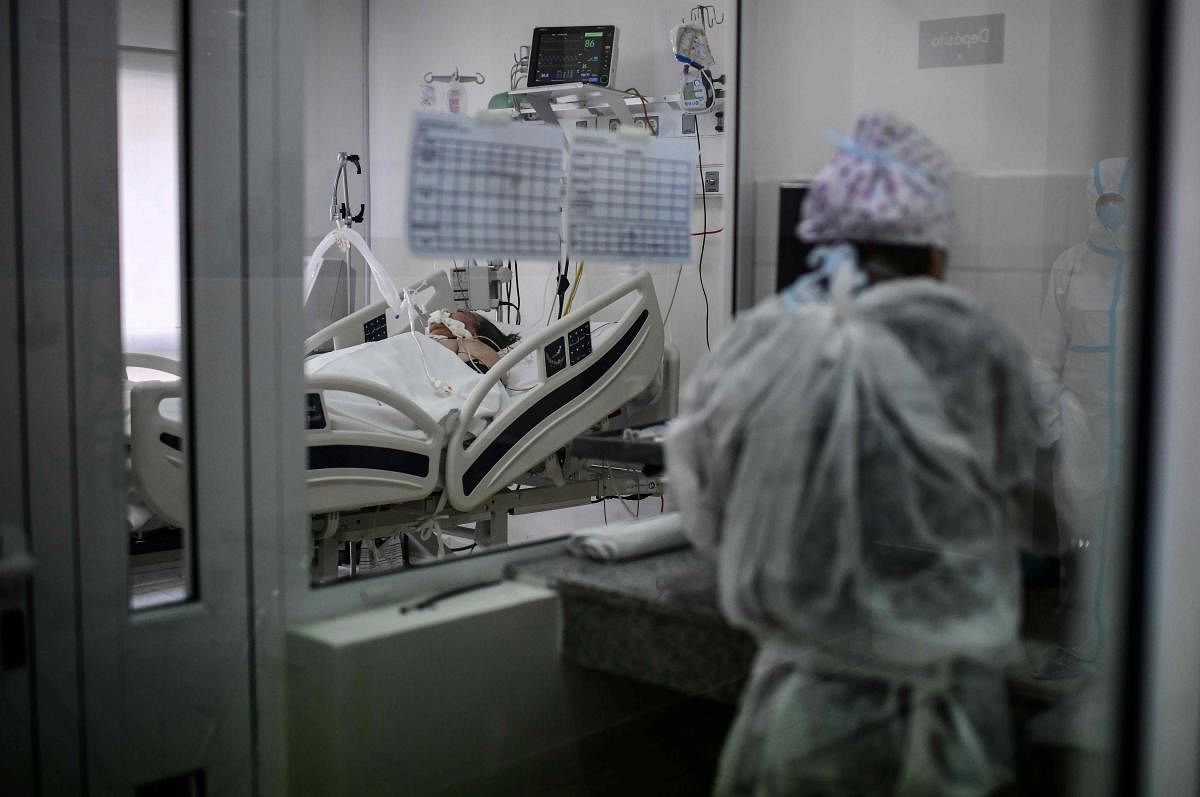 A patient infected with the new coronavirus remains in the Doctor Alberto Antranik Eurnekian Public Hospital in Ezeiza, in the outskirts of Buenos Aires on July 1, 2020. (Photo by RONALDO SCHEMIDT / AFP)