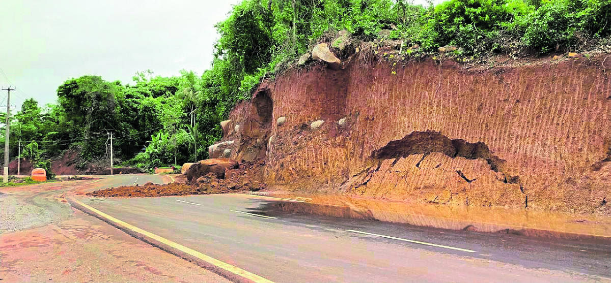 A hillock caved in on Kateel-Bajpe road on Friday.