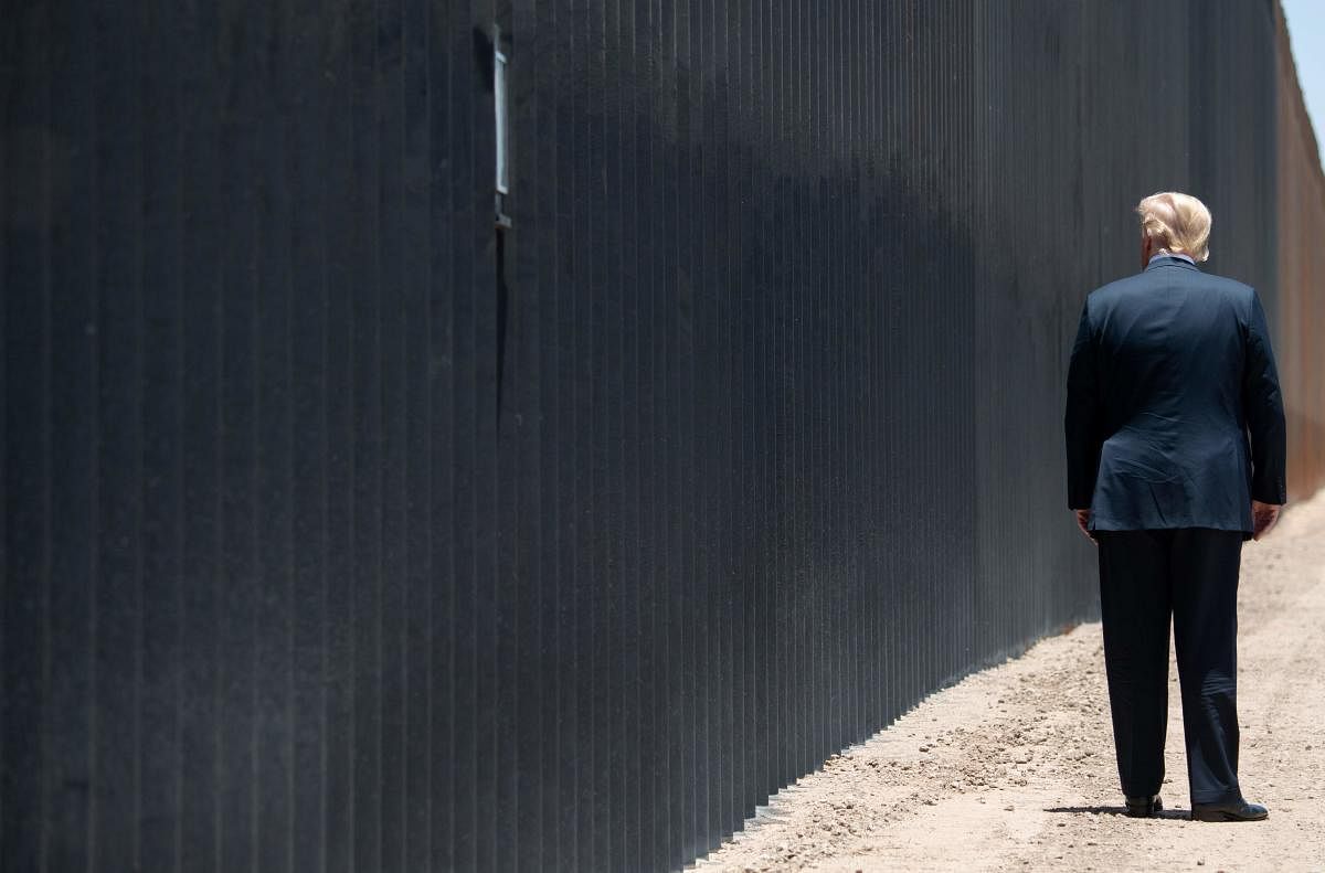  In this file photo US President Donald Trump participates in a ceremony commemorating the 200th mile of border wall at the international border with Mexico in San Luis, Arizona, June 23, 2020. Credit/AFP File Photo