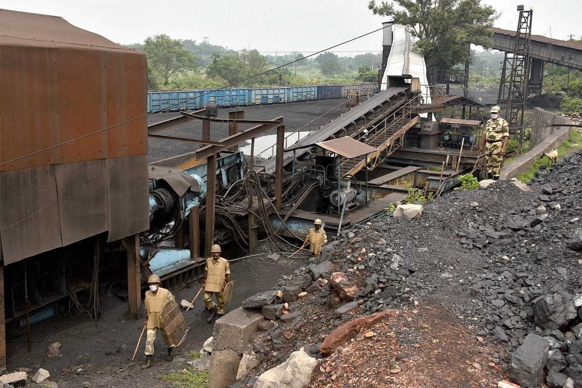 CISF jawans guard at the Coal Handling Plant (CHP) in Kustore area during a strike by the coal field workers against privatisation of coal mines, in Dhanbad. Credit: PTI Photo