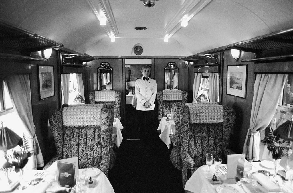 A steward in the dining car of the Orient Express as it leaves Victoria Station, London, 25th May 1982. Credit/Getty Images