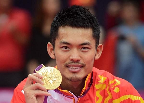 China's Lin Dan celebrating with his gold medal after beating Malaysia's Lee Chong Wei during the Men's Singles gold medal match at the London 2012 Olympic Games in London. Credit: AFP Photo