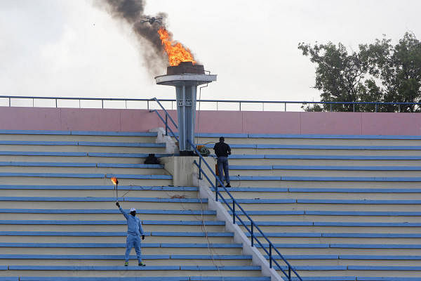 A ceremonial torch is lit to mark the reopening of the stadium in Mogadishu, Somalia Tuesday, June 30, 2020. Credit: AP Photo