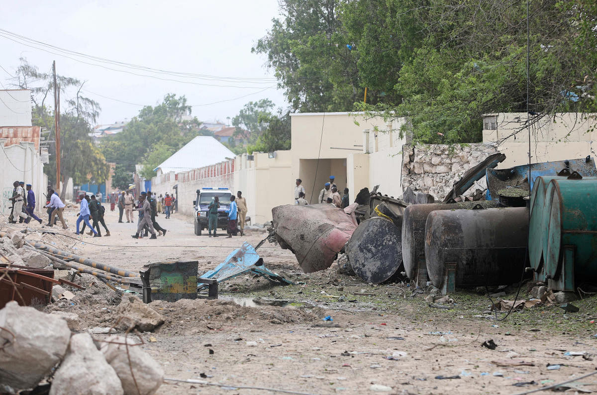 A general view shows Somali policemen at the scene after suicide car bomber drove into a checkpoint outside the port in Mogadishu, Somalia. Credit: Reuters Photo