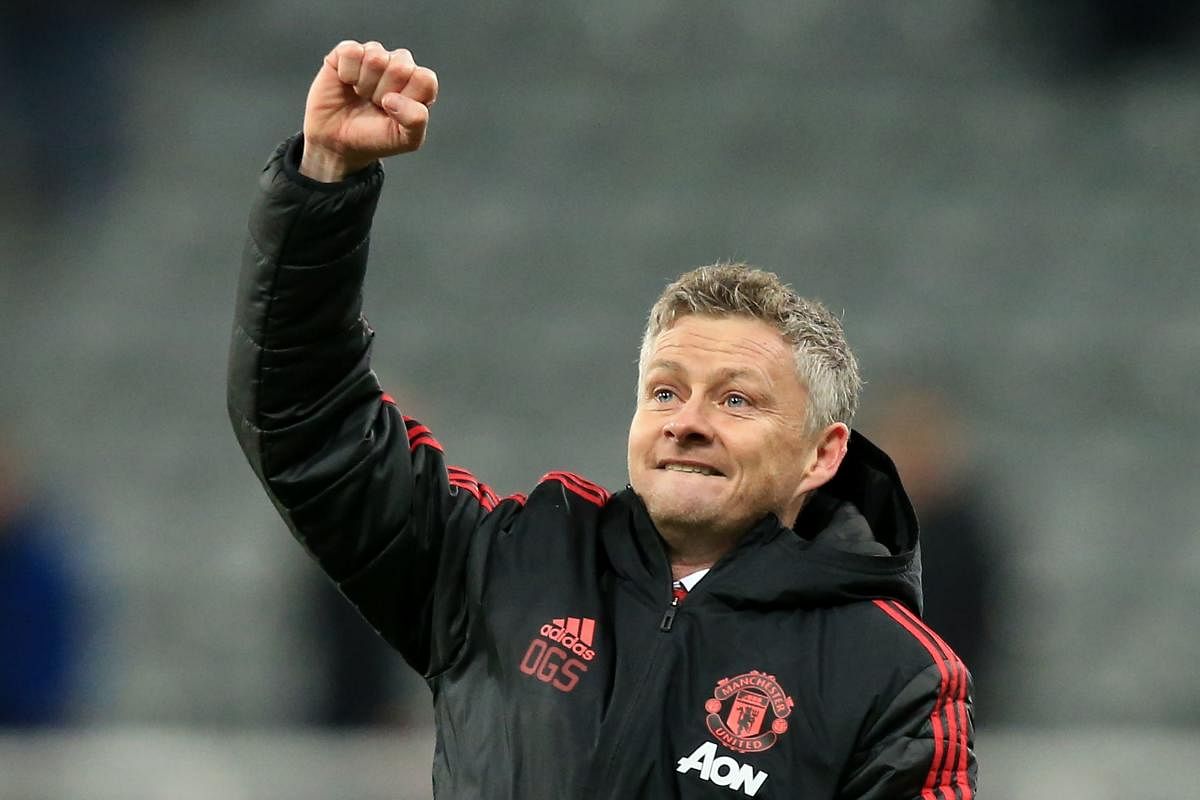 Manchester United's Norwegian caretaker manager Ole Gunnar Solskjaer applauds the fans following the English Premier League football match between Newcastle United and Manchester United at St James' Park in Newcastle-upon-Tyne, north east England. Credit/AFP File Photo