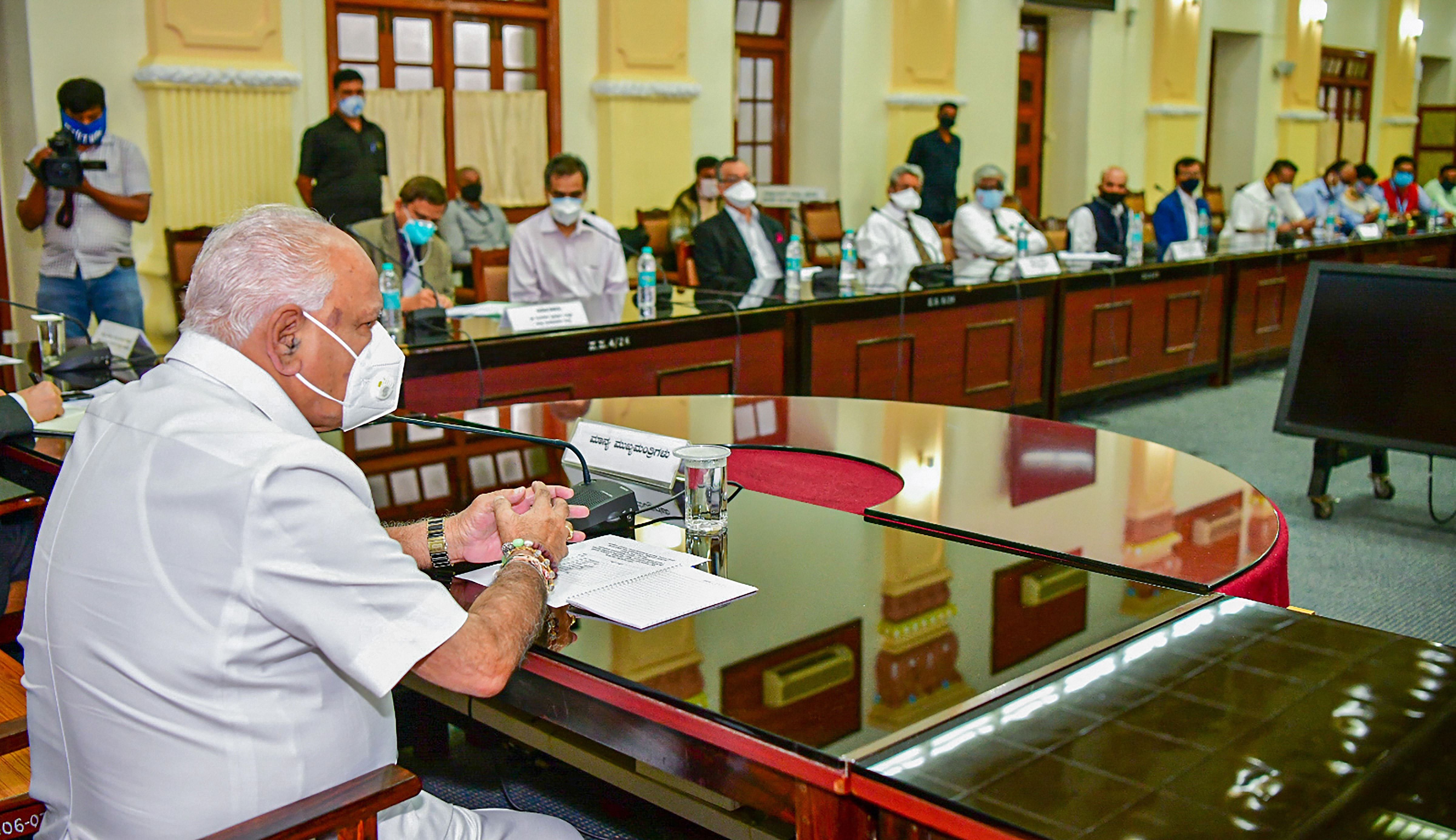 Karnataka Chief Minister B S Yediyurappa chairs a meeting with experts and senior officers to discuss ways forward in Covid-19 management, in Bengaluru, Wednesday, July 1, 2020. (PTI Photo)