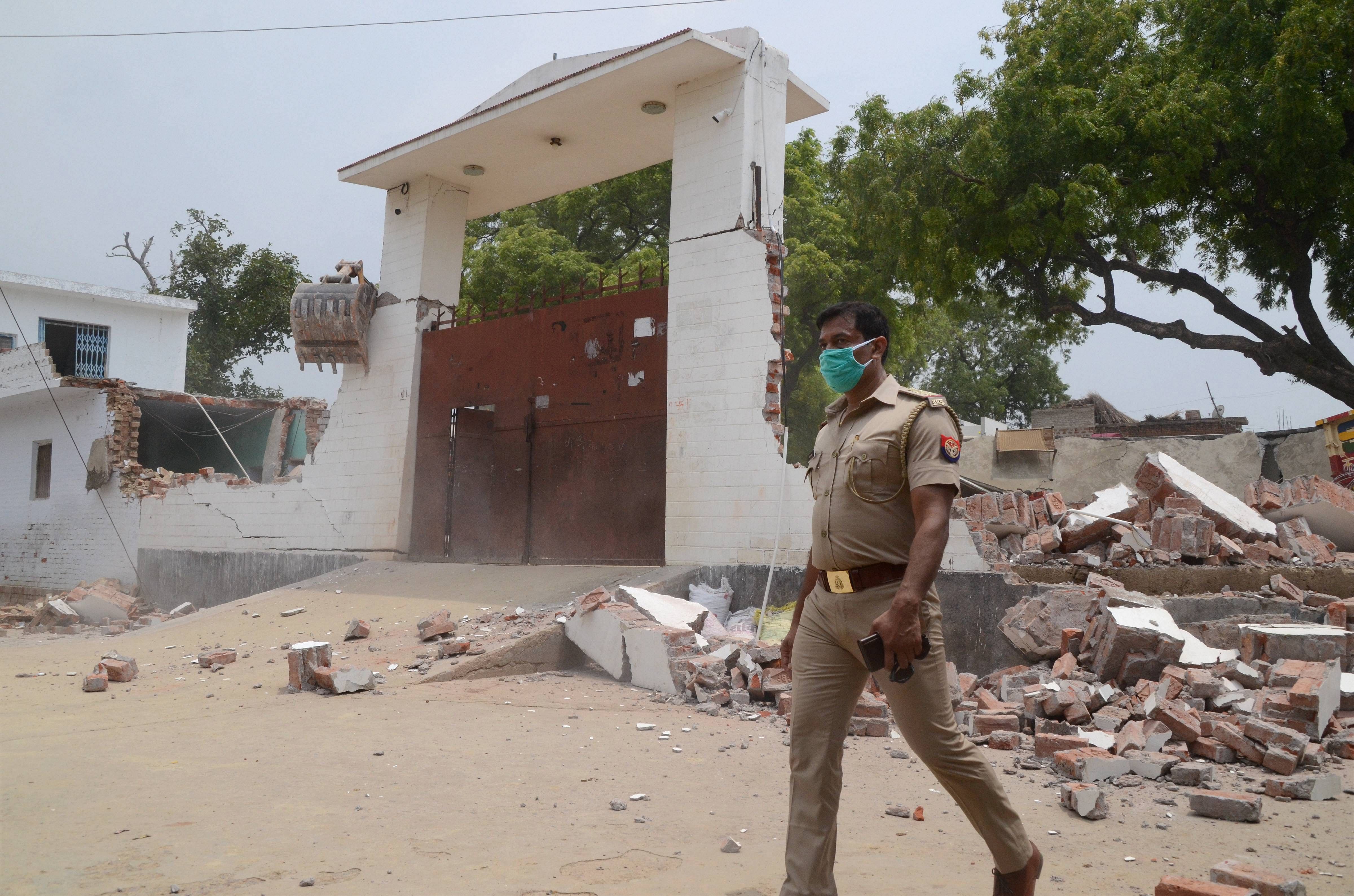Debris lie on the ground following the demolition of the residence of criminal Vikay Dubey, after an encounter in Bikaru village where 8 police personnel lost their lives, in Kanpur, Saturday, July 4, 2020. The encounter took place when the police team was approaching to arrest Vikas Dubey, a history-sheeter facing 60 criminal cases, on the intervening night of Thursday and Friday. (PTI Photo)