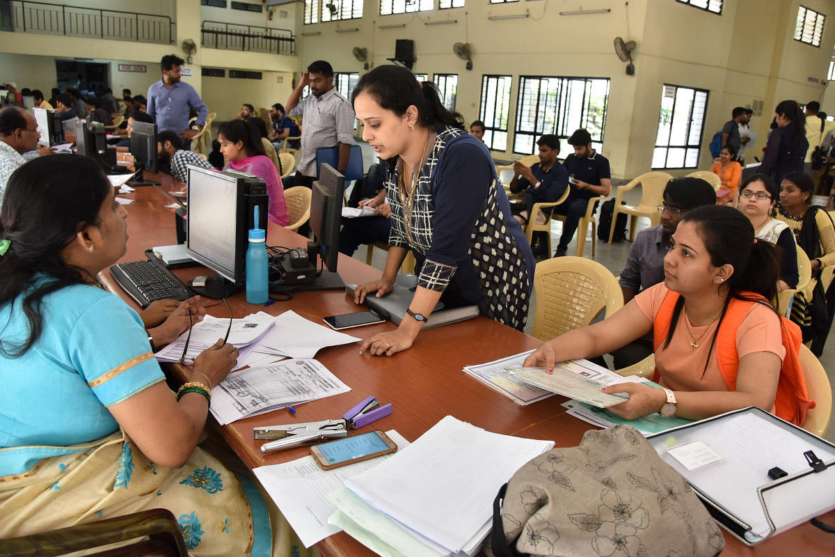 A file picture of document verification conducted by the Karnataka Examinations Authority. The Covid-19 pandemic has cast a shadow on Common Entrance Test this year. DH Photo