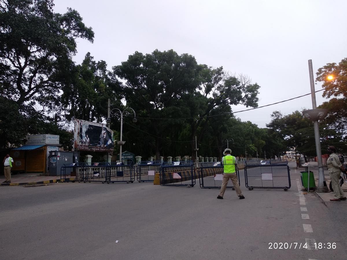 The barricade put up towards KR Circle on New Sayyaji Rao Road in Mysuru on Saturday.DH Photo/T R Sathish Kumar