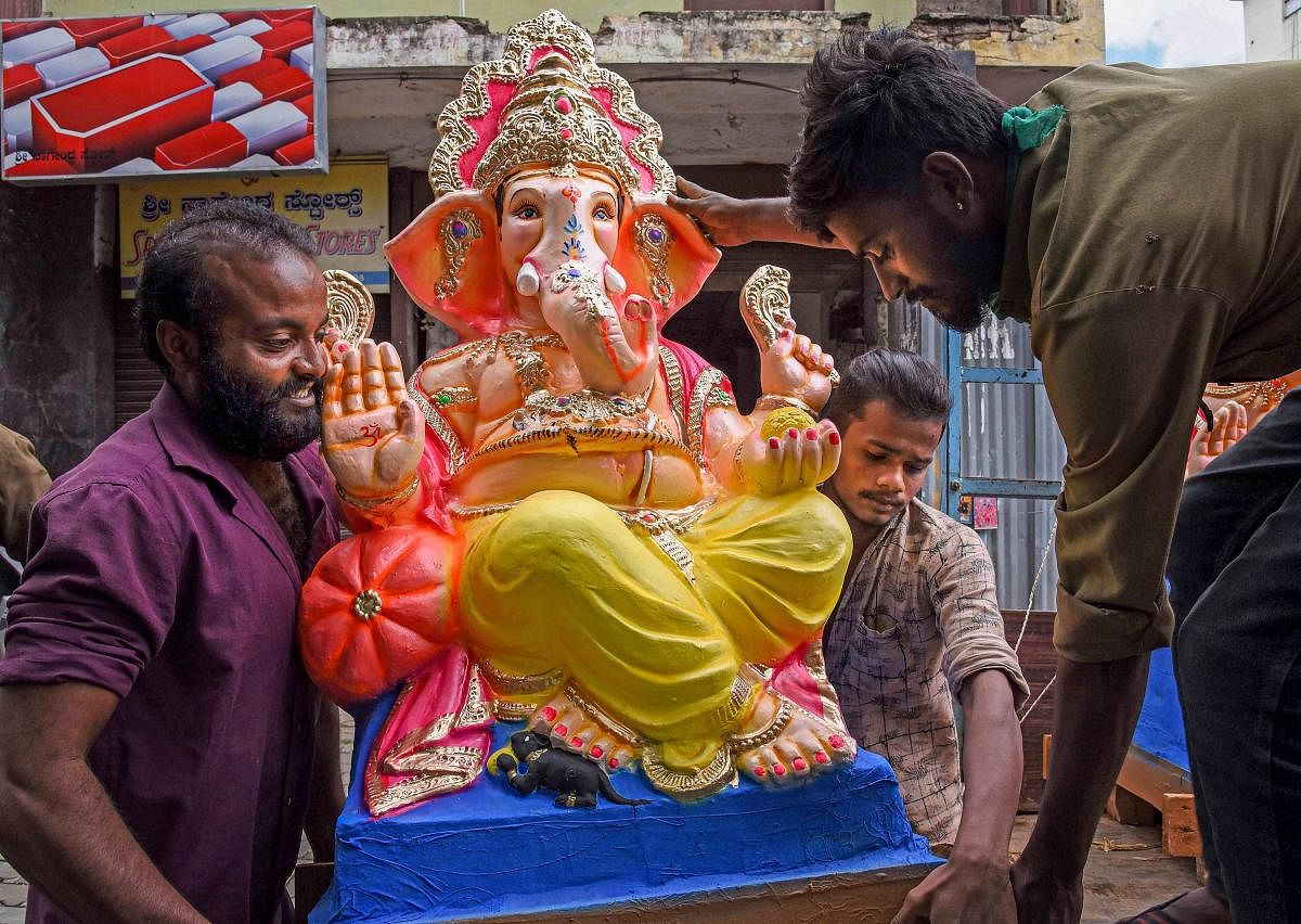 : Workers transport Ganesha idols to the market for sale ahead of the Ganesh Chaturthi festival (PTI Photo)