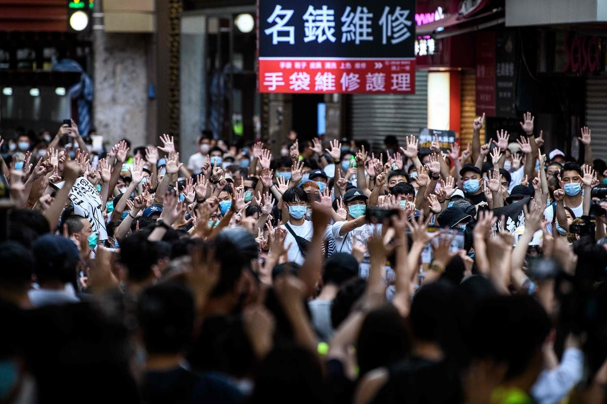  Protesters chant slogans and gesture during a rally against a new national security law in Hong Kong on July 1, 2020, on the 23rd anniversary of the city's handover from Britain to China. Credit/AFP File Photo