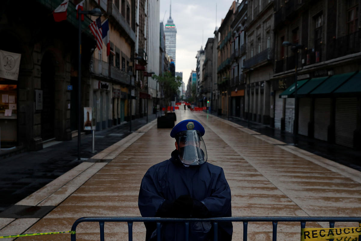 A police officer guards a closed road at the city center after amenities and businesses were shut for the second time this weekend due to overcrowding over the last few days, as the coronavirus disease (COVID-19) outbreak continues, in Mexico City, Mexico July 4, 2020. Credit: Reuters File Photo