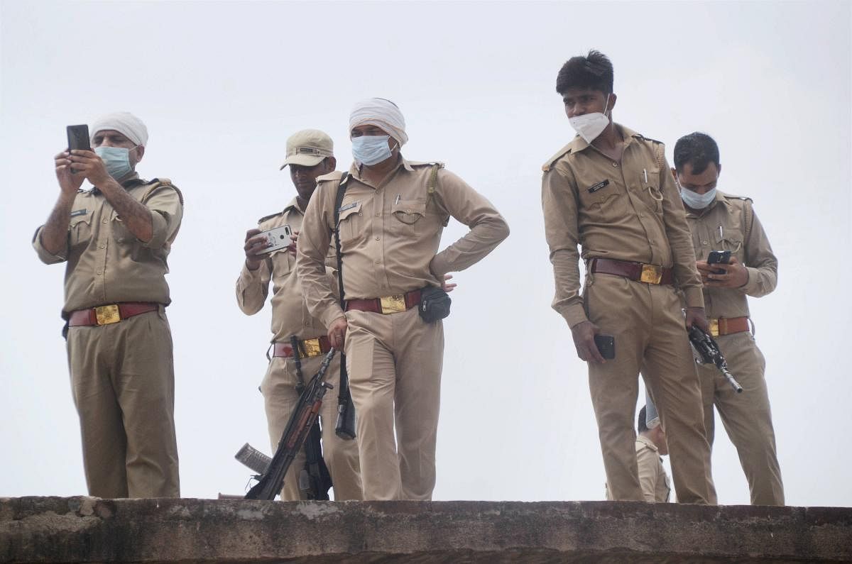 Police personnel at the residence of criminal Vikas Dubey, after an encounter in Bikaru village where 8 police personnel lost their lives, in Kanpur, Saturday, July 4, 2020. The encounter took place when the police team was approaching to arrest Vikas Dubey, a history-sheeter facing 60 criminal cases, on the intervening night of Thursday and Friday. (PTI Photo)