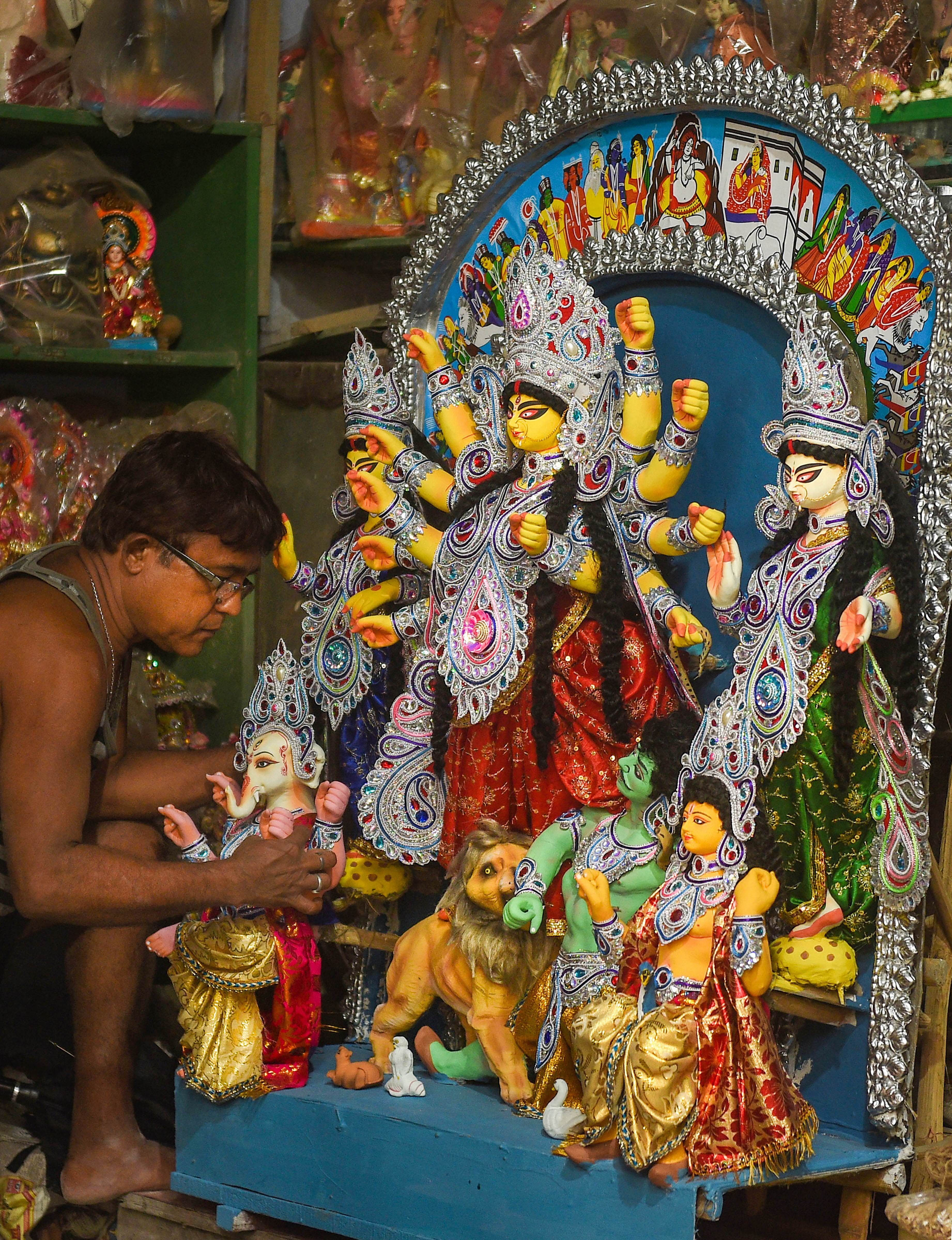 An artist makes an idol of Goddess Durga at Kumartuli, during Unlock 2.0, in Kolkata, Sunday, July 5, 2020. (PTI Photo)