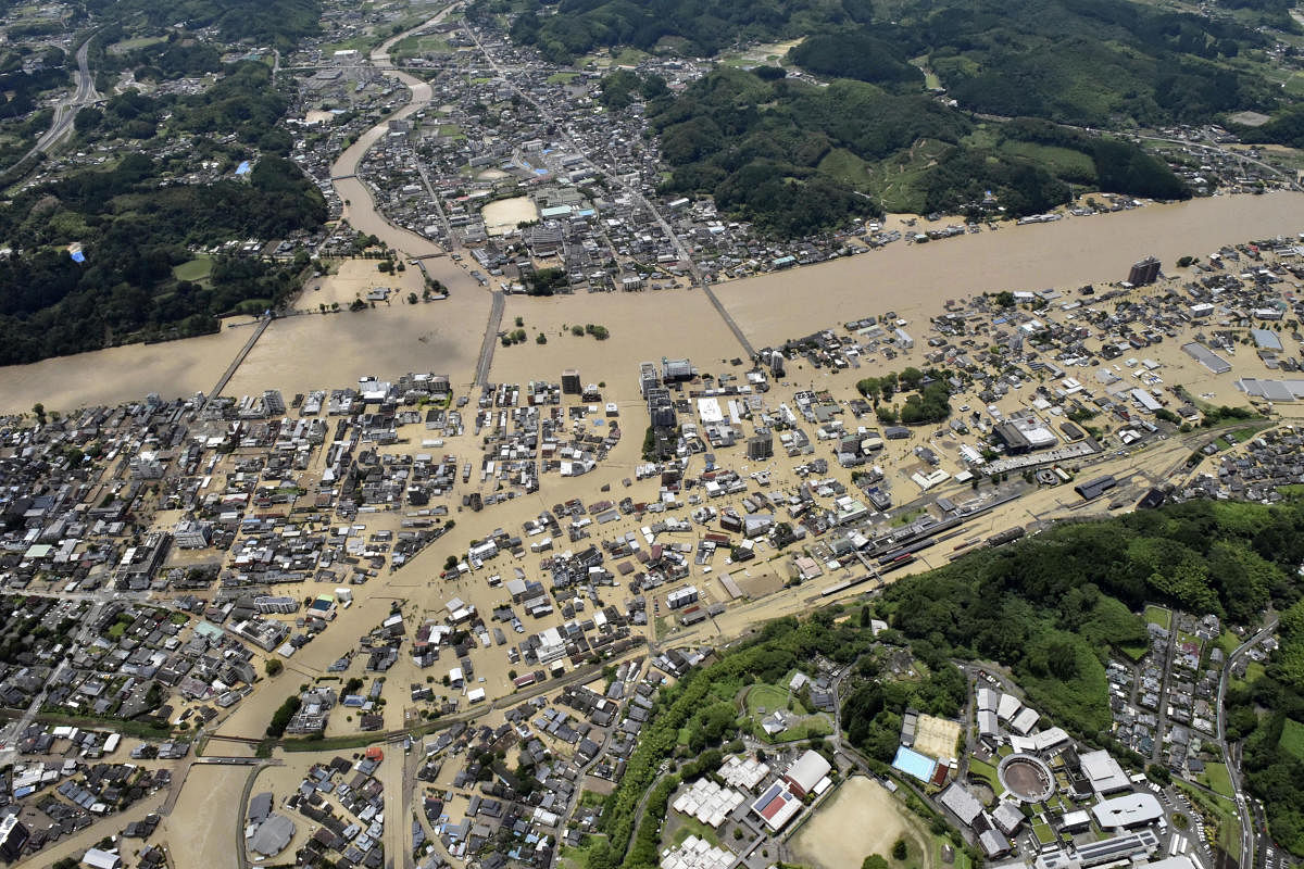 Areas are inundated in muddy waters that gushed out from the Kuma River in Hitoyoshi, Kumamoto prefecture, southwestern Japan, Saturday, July 4, 2020. Credit/AP Photo