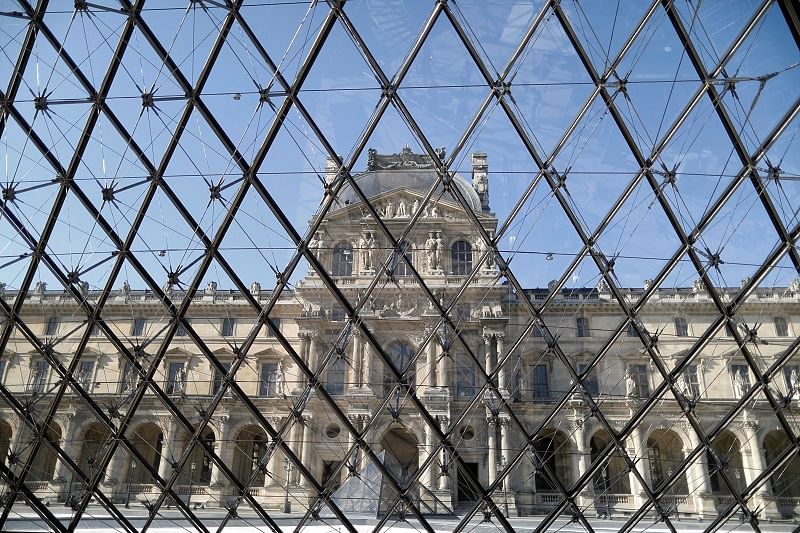 The Louvre museum is seen through the Pyramid, designed by Chinese-born U.S. architect Ieoh Ming Pei, in Paris as the museum prepares to reopen its doors to the public. Credits: Reuters Photo