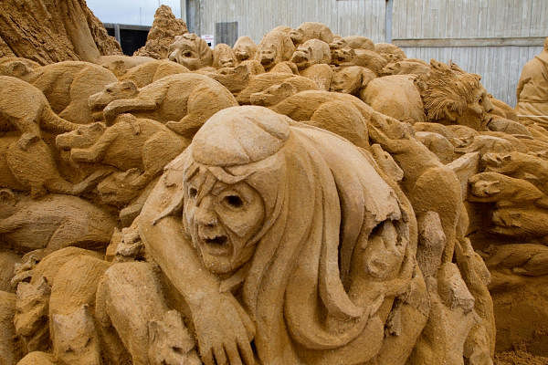Sand sculpture of a covert with rats and black death. Credit: Getty Images
