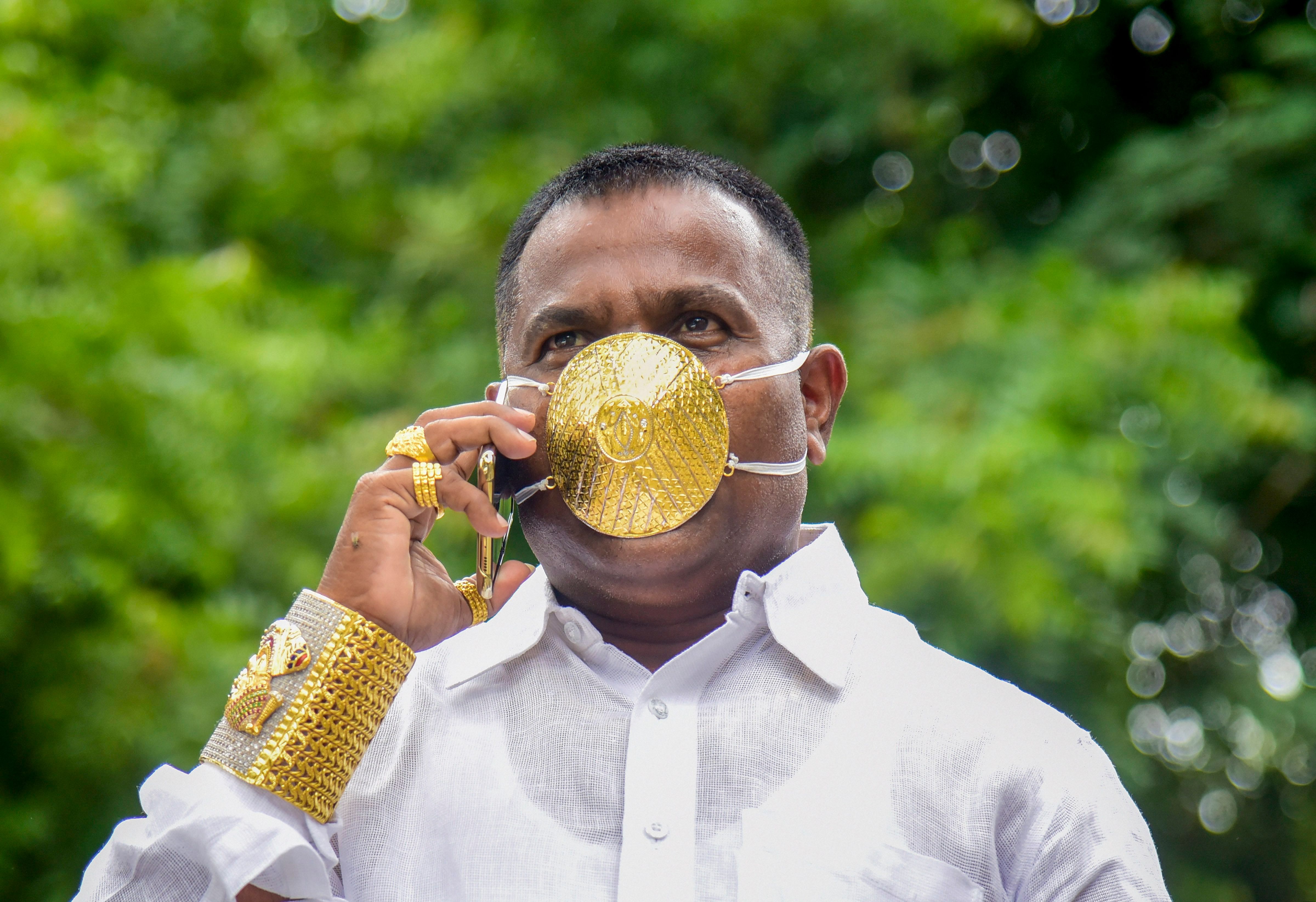 A businessman wears a protective mask made of gold in Pune. Credit: PTI
