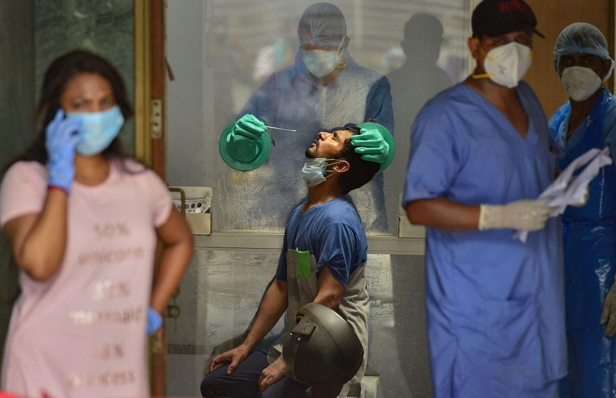 Suspected coronavirus patients arrive at a government hospital for tests during Unlock 2, in New Delhi. Credit: PTI Photo