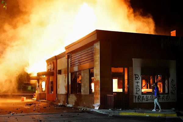 A Wendy’s burns following a rally against racial inequality and the police shooting death of Rayshard Brooks, in Atlanta. Credit: Reuters