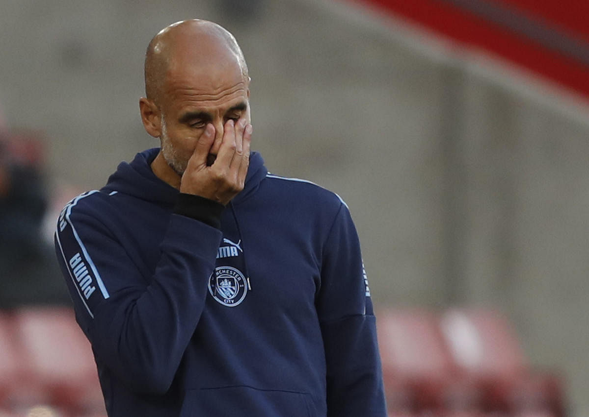 Manchester City manager Pep Guardiola looks dejected after defeat against Southampton. Credit: Reuters