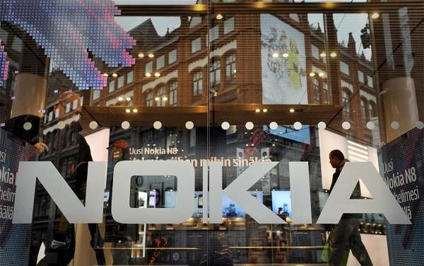 The logo of Finland's mobile phone maker Nokia is seen on the window of Nokia flagship store in Helsinki. Credit: AFP