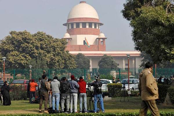 Television journalists are seen outside the premises of the Supreme Court in New Delhi, India, January 22, 2020. Credit: Reuters Photo