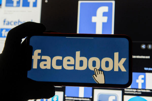 The Facebook logo is displayed on a mobile phone. Credit: Reuters Photo