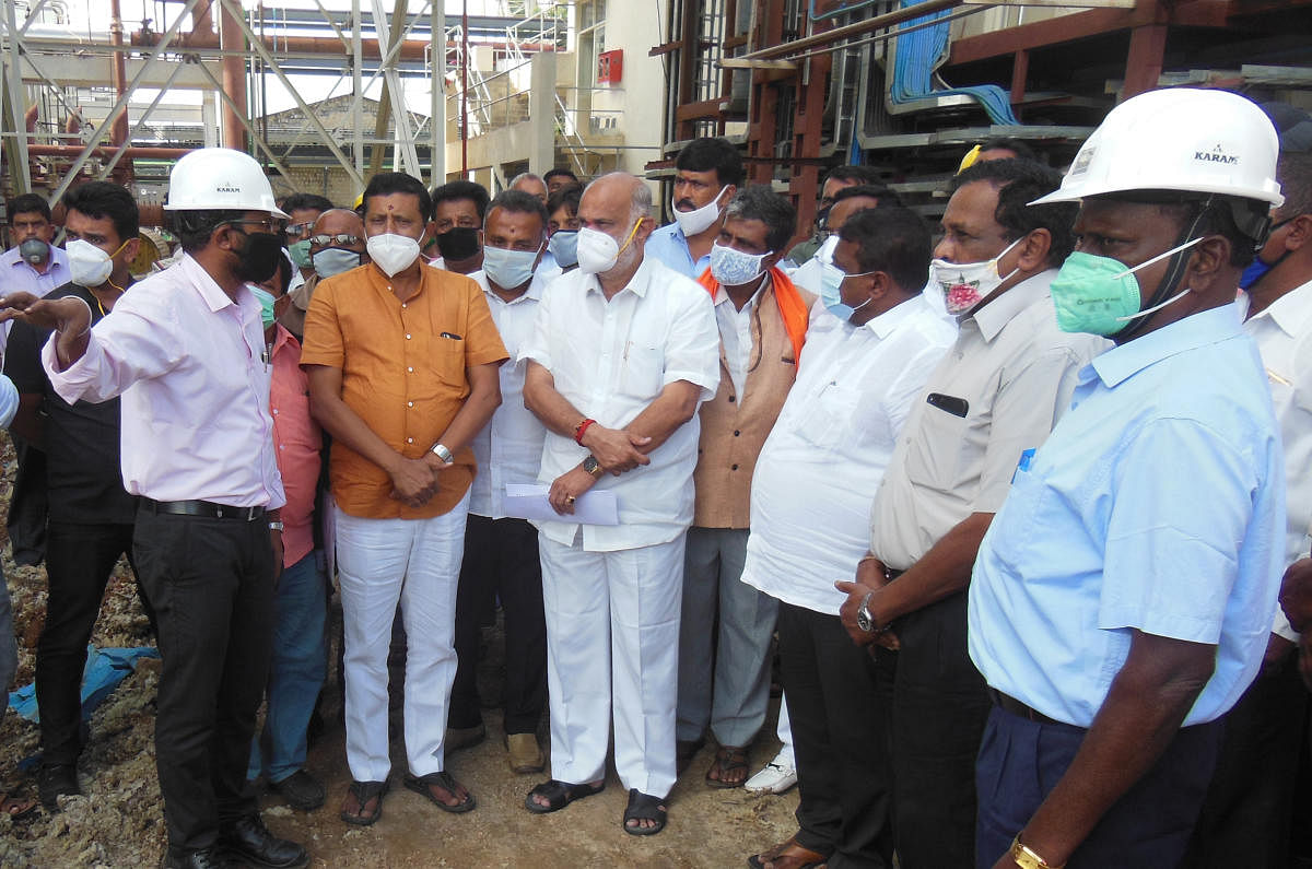 Labour and Sugar Minister Shivaram Hebbar inspects Chamundeshwari Sugar factory in Channarayapatna, Hassan district, on Tuesday. MLA C N Balakrishna is seen.