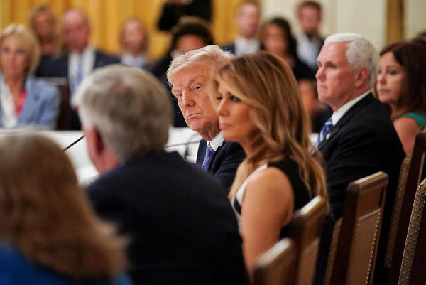 US President Donald Trump is seated with first lady Melania Trump as he listens to reopening schools amid the coronavirus pandemic. Credit: Reuters
