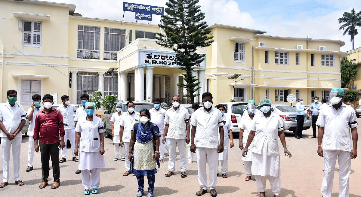 Trainee nurses protest at K R Hospital in Mysuru on Wednesday. DH PHOTO