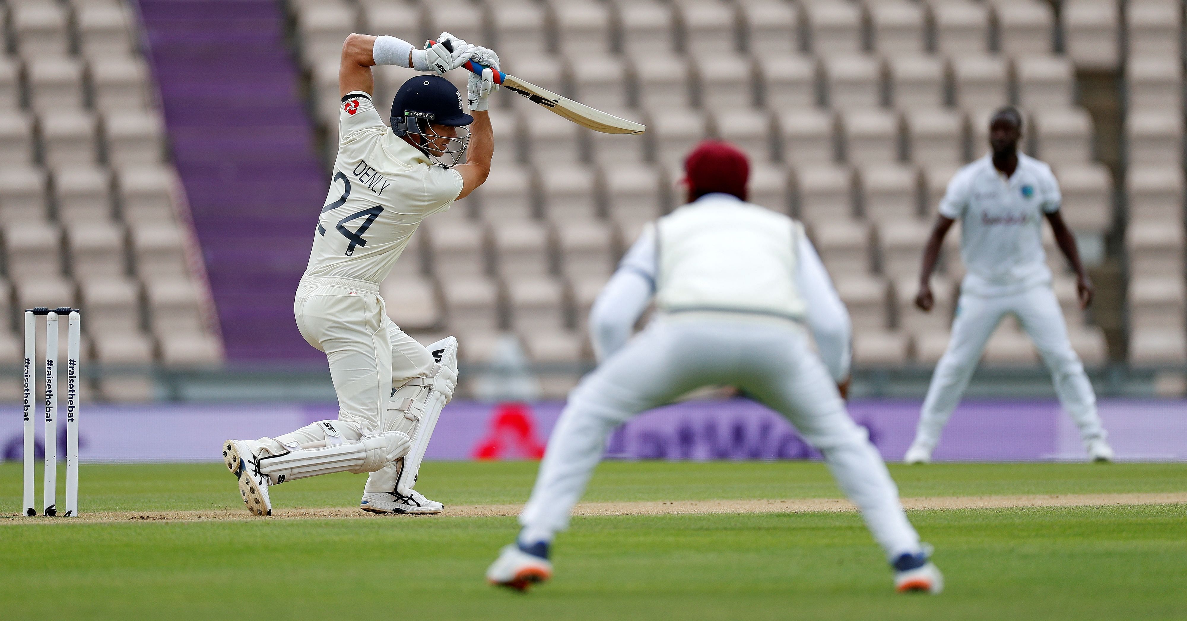 England's Joe Denly (L) plays a shot on the first day of the first Test cricket match between England and the West Indies at the Ageas Bowl in Southampton, southwest England. Credit: AFP