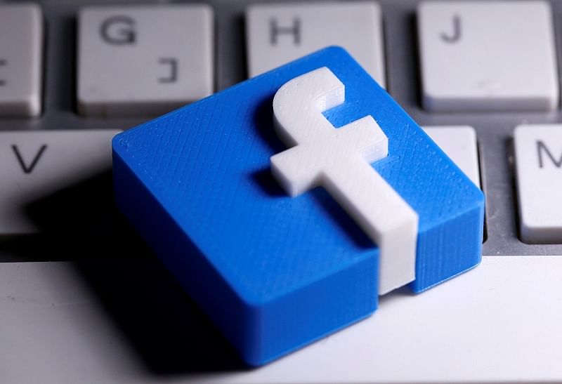 A 3D-printed Facebook logo is seen placed on a keyboard in this illustration. Credits: Reuters Photo