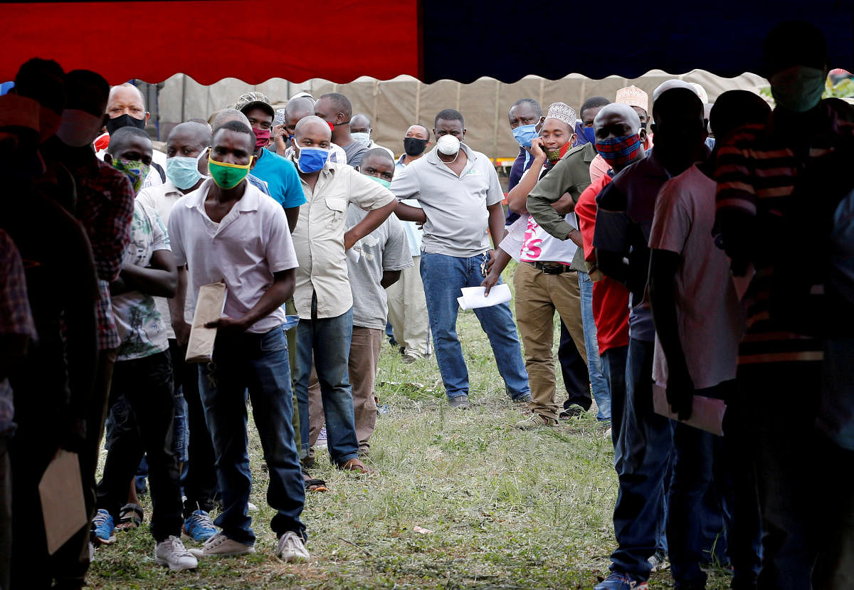 Truck drivers queue to get tested for the coronavirus disease (Covid-19) at the Namanga one stop border crossing point between Kenya and Tanzania. Credit: Reuters Photo