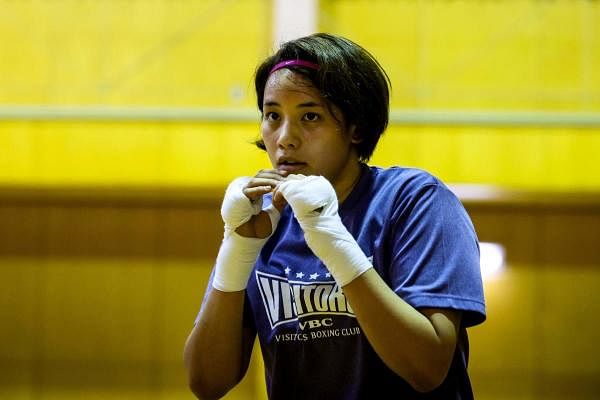 Japanese boxer and nurse Arisa Tsubata warming up during her training. Credit: AFP