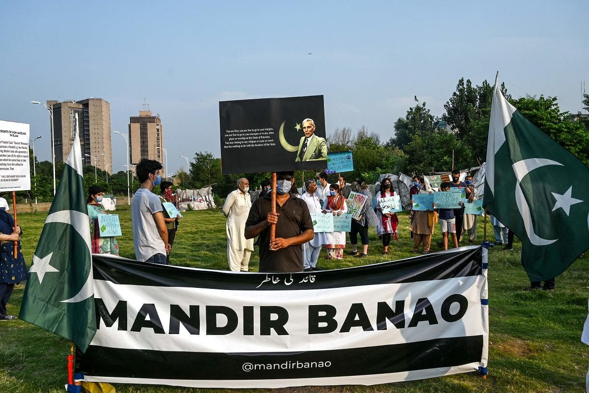 Demonstrators hold placards during a protest in Islamabad on July 8, 2020, as they demand the government to allow the construction of a Hindu temple in the Pakistan's capital. Credit: AFP Photo