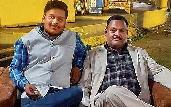 Notorious gangster Vikas Dubey with his aide Amar Dubey (L) during an event. Credit: PTI Photo