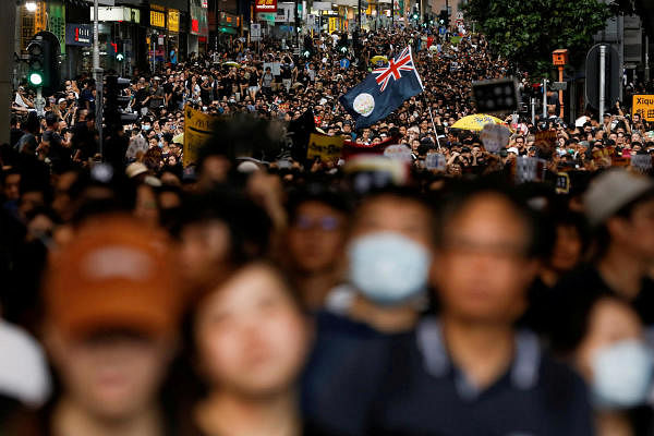 The colonial flag of Hong Kong flies over a march of anti-extradition bill protesters to West Kowloon Express Rail Link Station in Hong Kong. Credit: Reuters Photo
