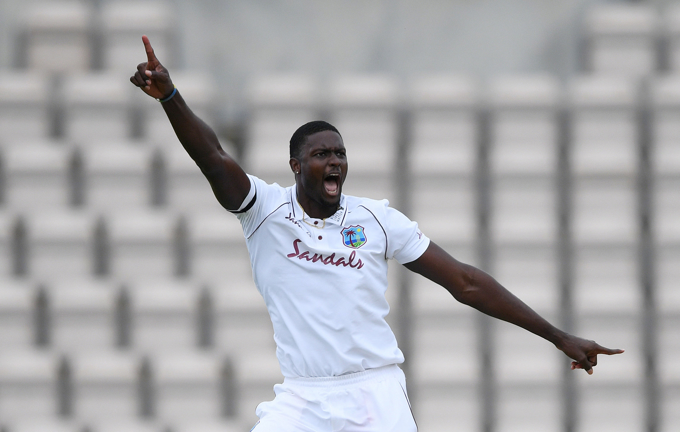 West Indies' Jason Holder celebrates taking the wicket of England's Ben Stokes, as play resumes behind closed doors following the outbreak of the coronavirus. Credit: Reuters Photo